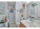 Charming bathroom with a shower, vanity, and coastal-themed decorations at 9412 Jewel Lake Ave, Las Vegas, NV 89166