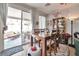 Cozy dining area with a wooden table, chairs, and sliding doors leading to an outdoor patio at 9412 Jewel Lake Ave, Las Vegas, NV 89166