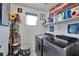 Bright laundry room features a modern washer and dryer with shelving and decor at 9412 Jewel Lake Ave, Las Vegas, NV 89166