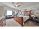 Spacious main bedroom featuring a large bed, ceiling fan, and ample natural light at 9412 Jewel Lake Ave, Las Vegas, NV 89166