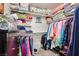 Organized walk-in closet with shelves and hanging racks for clothing storage at 9412 Jewel Lake Ave, Las Vegas, NV 89166