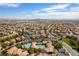 High aerial shot of neighborhood with community pool, trees, and meticulously maintained streets at 9465 Perennial View Ave, Las Vegas, NV 89148