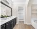Spacious bathroom with double vanity, framed mirror, and separate shower and tub at 9465 Perennial View Ave, Las Vegas, NV 89148
