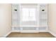 Comfortable bedroom with wall-to-wall carpet, built-in shelves and a window at 9465 Perennial View Ave, Las Vegas, NV 89148
