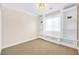 Cozy carpeted bedroom with built in shelving and great natural light at 9465 Perennial View Ave, Las Vegas, NV 89148
