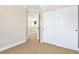 Bedroom with neutral color palette, wall-to-wall carpet, and walk-in closet at 9465 Perennial View Ave, Las Vegas, NV 89148