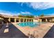 A beautiful community pool with ample deck space and pergola shading at 9465 Perennial View Ave, Las Vegas, NV 89148
