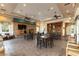 Inviting community room featuring a fireplace, tables, chairs, and bookshelves for gatherings and events at 9465 Perennial View Ave, Las Vegas, NV 89148