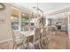 Bright dining room with access to the backyard and views of the kitchen at 9465 Perennial View Ave, Las Vegas, NV 89148