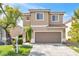 Charming two-story home features a well-manicured lawn and two-car garage in a desirable neighborhood at 9465 Perennial View Ave, Las Vegas, NV 89148
