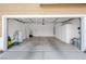 Large two car garage with custom cabinet and water heater at 9465 Perennial View Ave, Las Vegas, NV 89148
