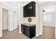 Hallway with carpet and a wet bar and a great view of the open concept living space at 9465 Perennial View Ave, Las Vegas, NV 89148