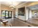 Elegant lobby area with comfortable seating, a reception desk, and access to community amenities at 9465 Perennial View Ave, Las Vegas, NV 89148