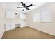 Bright office space with built-in cabinets, drawers, and desk, plus a modern ceiling fan at 9465 Perennial View Ave, Las Vegas, NV 89148