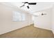 Bright office space leading to a living area, featuring a ceiling fan at 9465 Perennial View Ave, Las Vegas, NV 89148