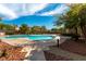 Scenic community pool surrounded by mature trees and landscaping offering residents a relaxing oasis at 9465 Perennial View Ave, Las Vegas, NV 89148
