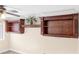 Custom wall shelving units offer storage and display space in this stylish room at 9465 Perennial View Ave, Las Vegas, NV 89148