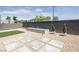 Modern backyard features a water feature, stone pavers, and gravel landscaping at 9732 Abel Cliff St, Las Vegas, NV 89143