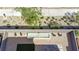 Aerial view of the backyard with pool, patio and turf with desert landscaping at 9732 Abel Cliff St, Las Vegas, NV 89143