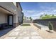 Modern backyard featuring a decorative water feature, gravel landscaping, and pavers at 9732 Abel Cliff St, Las Vegas, NV 89143