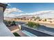 Tranquil backyard view featuring an outdoor water feature, minimalist landscaping, and neighborhood views at 9732 Abel Cliff St, Las Vegas, NV 89143