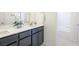 Bathroom with double sink vanity, modern fixtures, and separate toilet and shower area at 9732 Abel Cliff St, Las Vegas, NV 89143