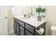Stylish bathroom featuring a modern vanity with a sink, and a towel rack at 9732 Abel Cliff St, Las Vegas, NV 89143