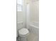 Well-lit bathroom featuring a clean toilet, shower, and tile flooring at 9732 Abel Cliff St, Las Vegas, NV 89143
