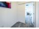 Hallway doorway opening into a bedroom with white door and gray carpet at 9732 Abel Cliff St, Las Vegas, NV 89143