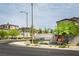Inviting community entrance with modern signage, desert landscaping and sidewalks at 9732 Abel Cliff St, Las Vegas, NV 89143