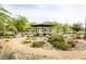 Relaxing community park featuring shaded seating area, winding paths, and lush landscaping at 9732 Abel Cliff St, Las Vegas, NV 89143