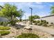 Community park with native plants, walking path, and decorative boulders at 9732 Abel Cliff St, Las Vegas, NV 89143