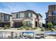 Modern two-story home with a two-car garage and low-maintenance landscaping in a sunny community at 9732 Abel Cliff St, Las Vegas, NV 89143