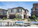 Contemporary two-story home features a landscaped yard and an attached two-car garage at 9732 Abel Cliff St, Las Vegas, NV 89143