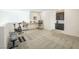 Bright and spacious flex space featuring an exercise area with desk and dark built-in cabinets at 9732 Abel Cliff St, Las Vegas, NV 89143