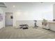 A light-filled flex space with carpet, recessed lighting, and a half-wall at 9732 Abel Cliff St, Las Vegas, NV 89143