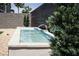 Landscaped backyard featuring a modern, stone fountain at 9732 Abel Cliff St, Las Vegas, NV 89143