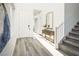 Bright entryway with hardwood floors, modern decor, stairs, and natural light at 9732 Abel Cliff St, Las Vegas, NV 89143
