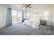 Spacious main bedroom with plush carpet, slider to balcony, and ample natural light at 9732 Abel Cliff St, Las Vegas, NV 89143