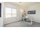 Bright office space featuring a large window with neighborhood views and neutral carpeting at 9732 Abel Cliff St, Las Vegas, NV 89143