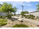 A neighborhood walking path through desert landscaping and mature trees at 9732 Abel Cliff St, Las Vegas, NV 89143