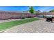 Spacious backyard with brick paver patio, artificial turf, and well-maintained landscaping at , Las Vegas, NV 89149