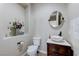 Powder room with modern vessel sink and round mirror at , Las Vegas, NV 89149