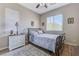 Bedroom with white wooden furniture, neutral walls, hardwood flooring, and natural light at , Las Vegas, NV 89149