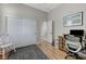 Bright bedroom with wood floors, closet, and desk, perfect for work or relaxation at , Las Vegas, NV 89149