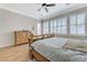 Comfortable bedroom with a king sized bed, hardwood floors, and large windows at , Las Vegas, NV 89149