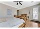 Comfortable bedroom features hardwood floors and a ceiling fan and access to the exterior at , Las Vegas, NV 89149