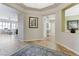 Elegant foyer with tile flooring, art niches, and a seamless transition to the living areas at , Las Vegas, NV 89149