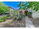 A beautifully landscaped front yard with desert plants leads to the charming home entrance at , Las Vegas, NV 89149