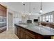 The open-plan kitchen leads to the living room and dining areas at , Las Vegas, NV 89149